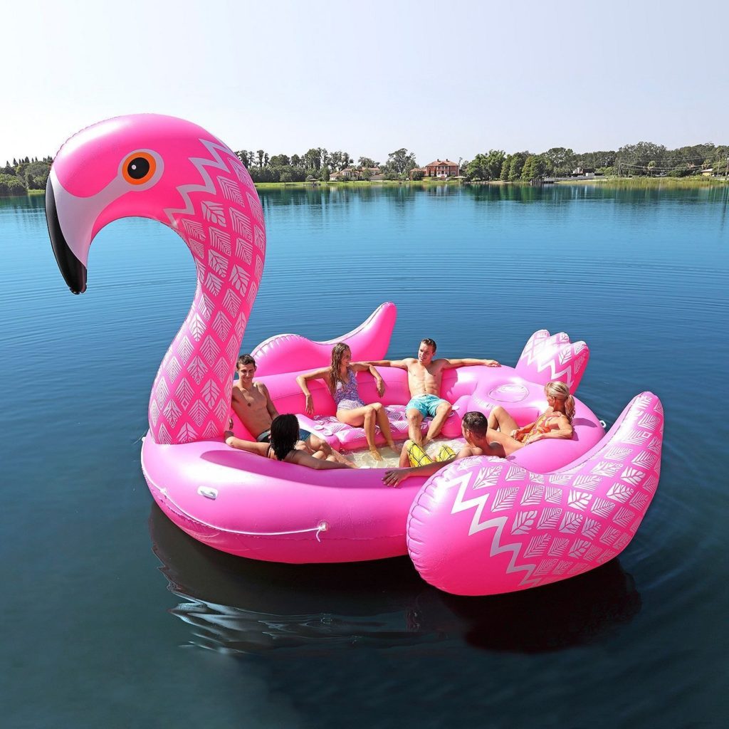 Flamingo uimapatja, jonka kyydissä on 6 aikuista